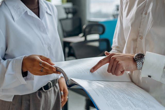 Two people looking at paperwork